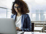 Woman in front of laptop